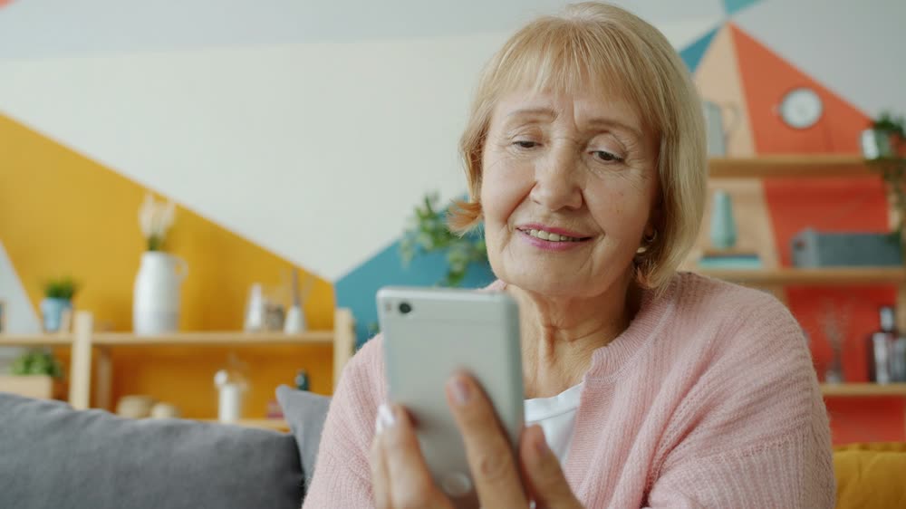 A customer smiling at her phone