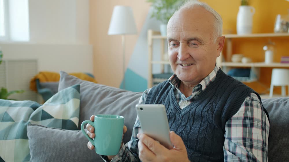 A customer at home with his phone